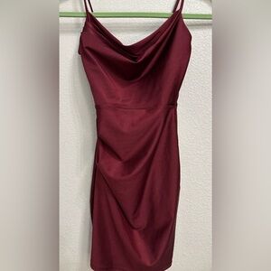 The dress is from Windsor. The size is XS. The dress color is a burgundy red.